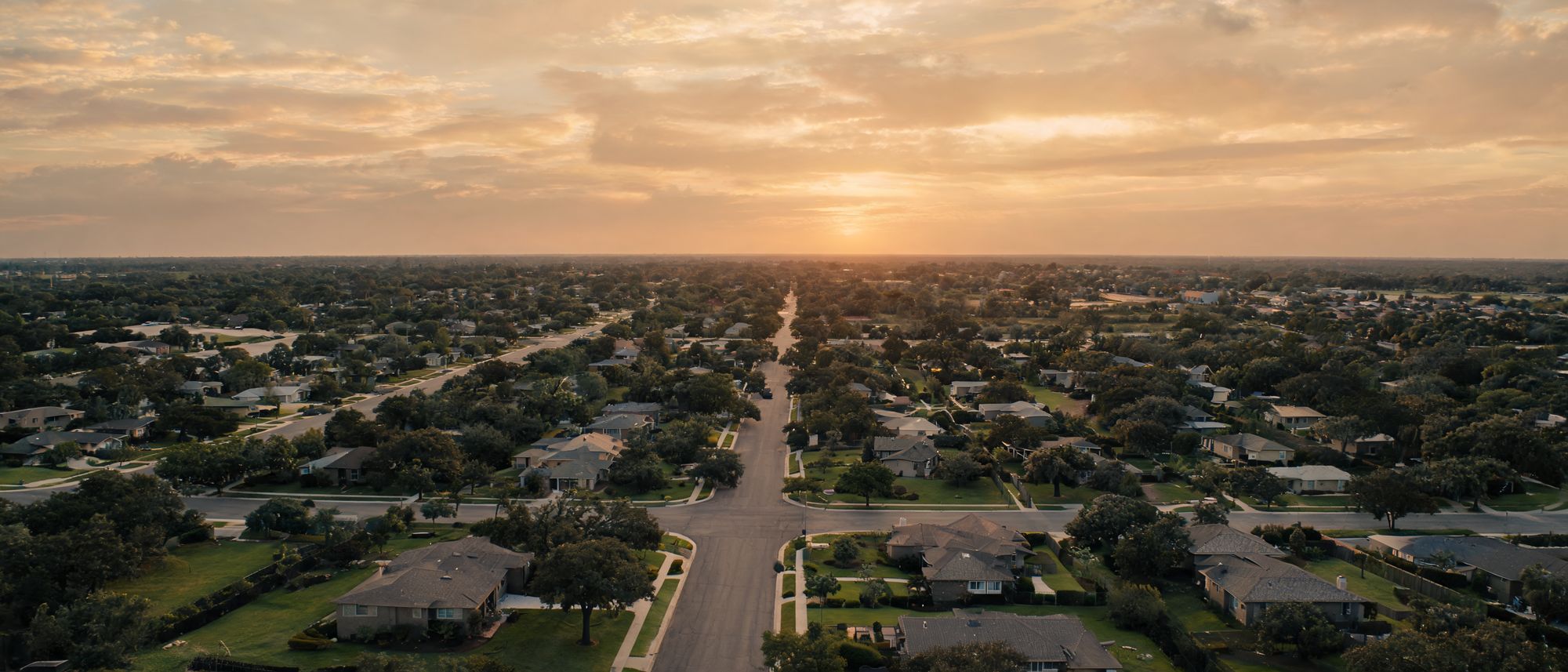 Aerial view of a Texas suburban neighborhood at golden hour